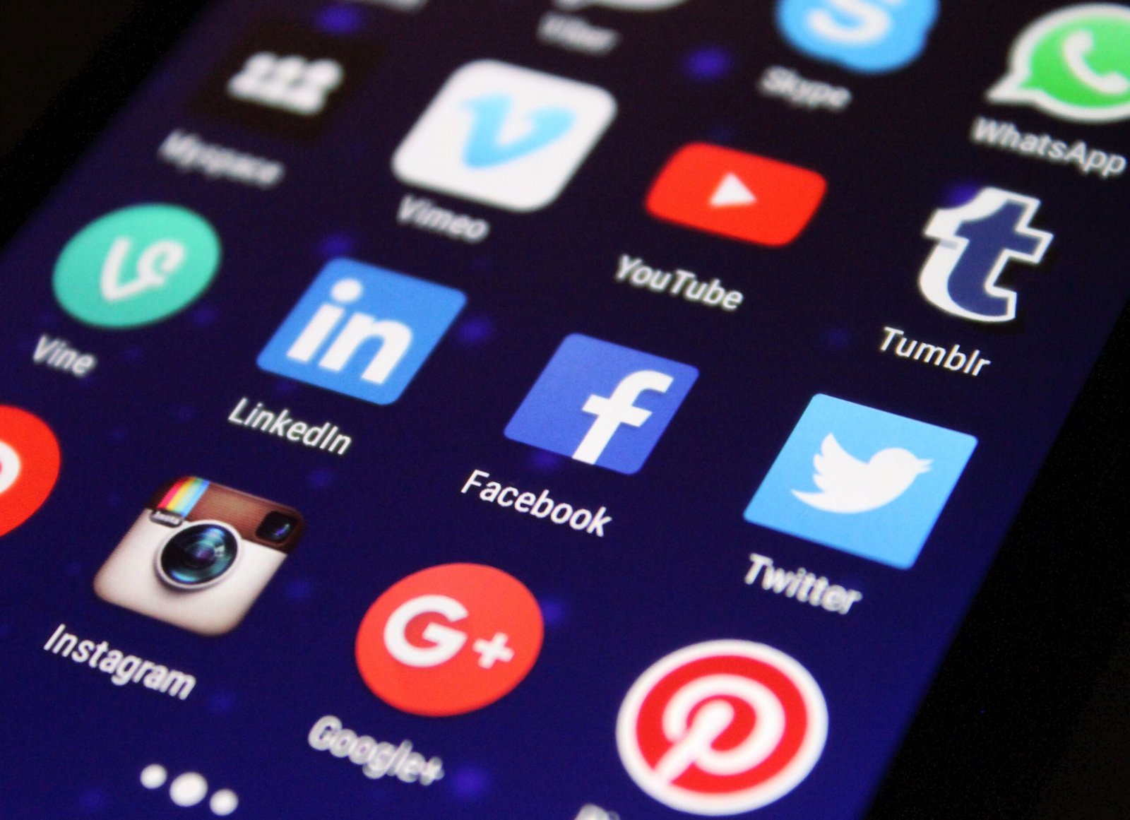Close-up of social media app icons on a smartphone screen