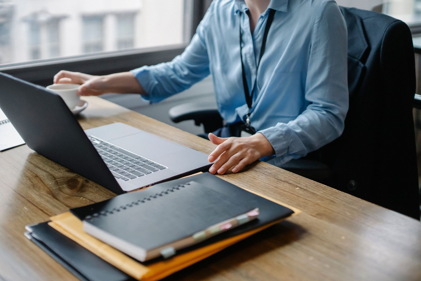Person working on laptop, managing email campaigns