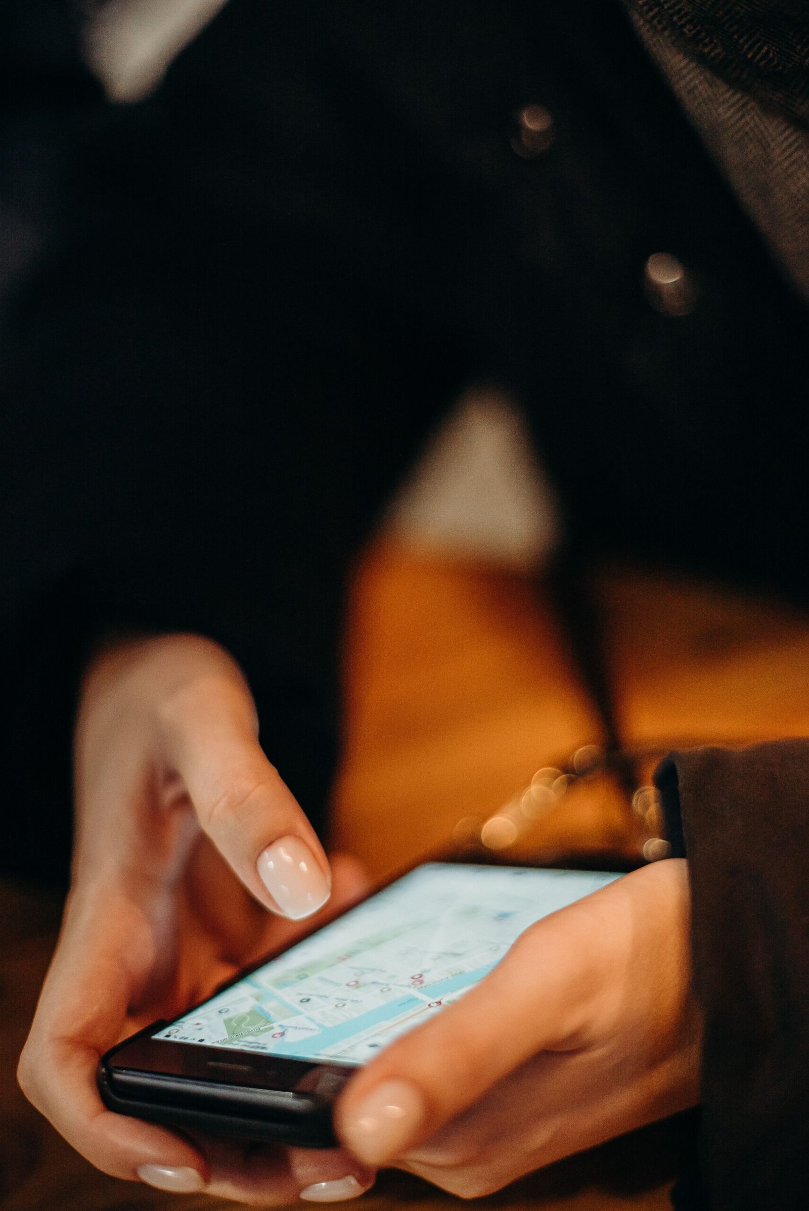 Hand using a smartphone for map navigation