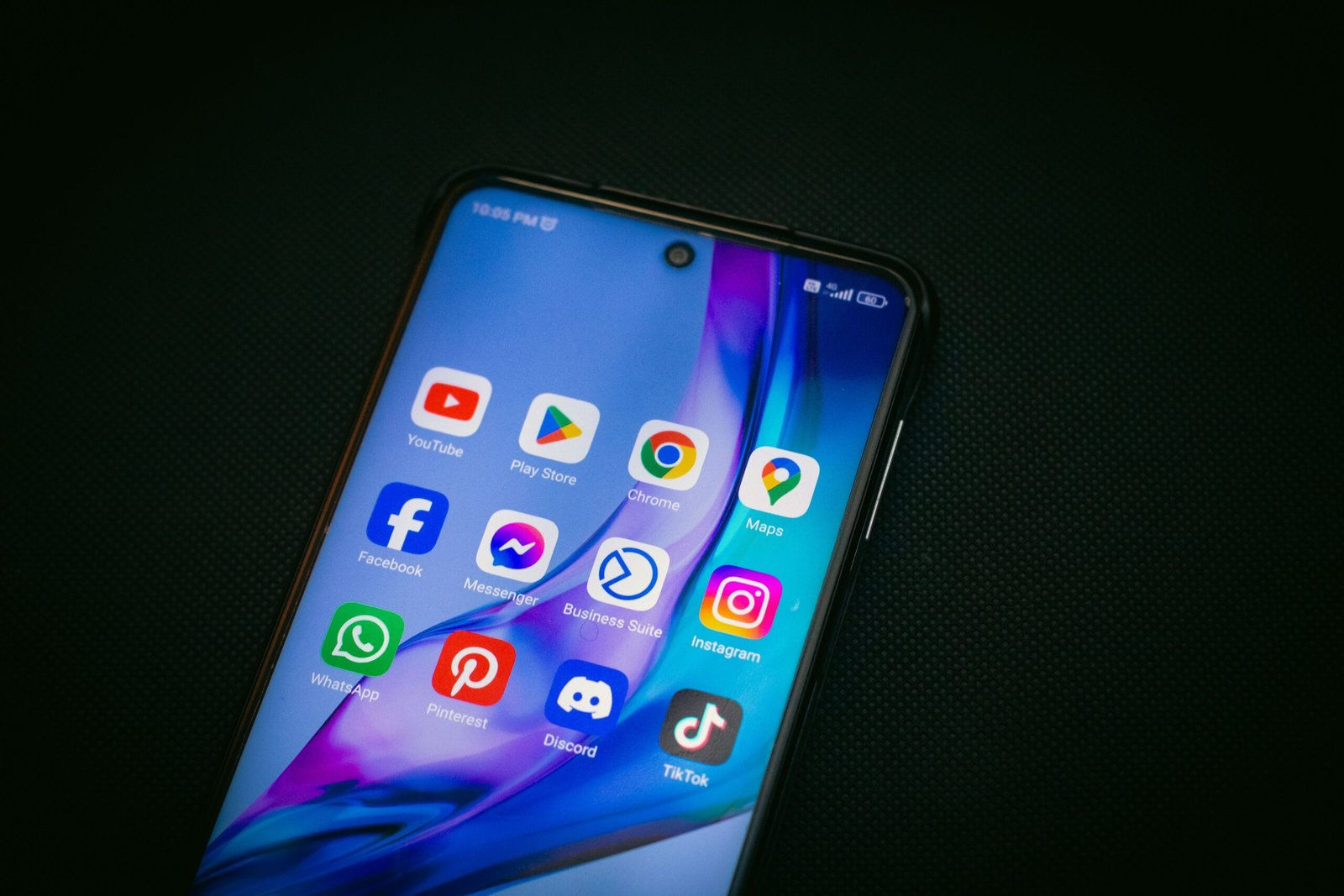 Smartphone screen showing YouTube and other app icons